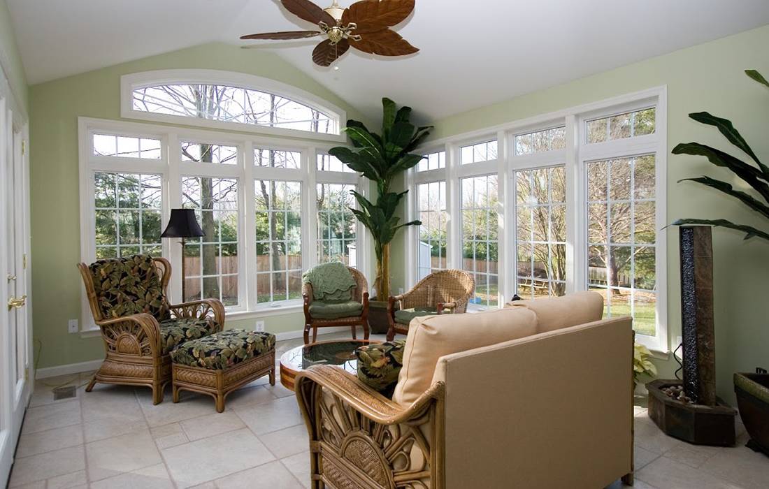 Sun room addition built onto a house with green wall paper