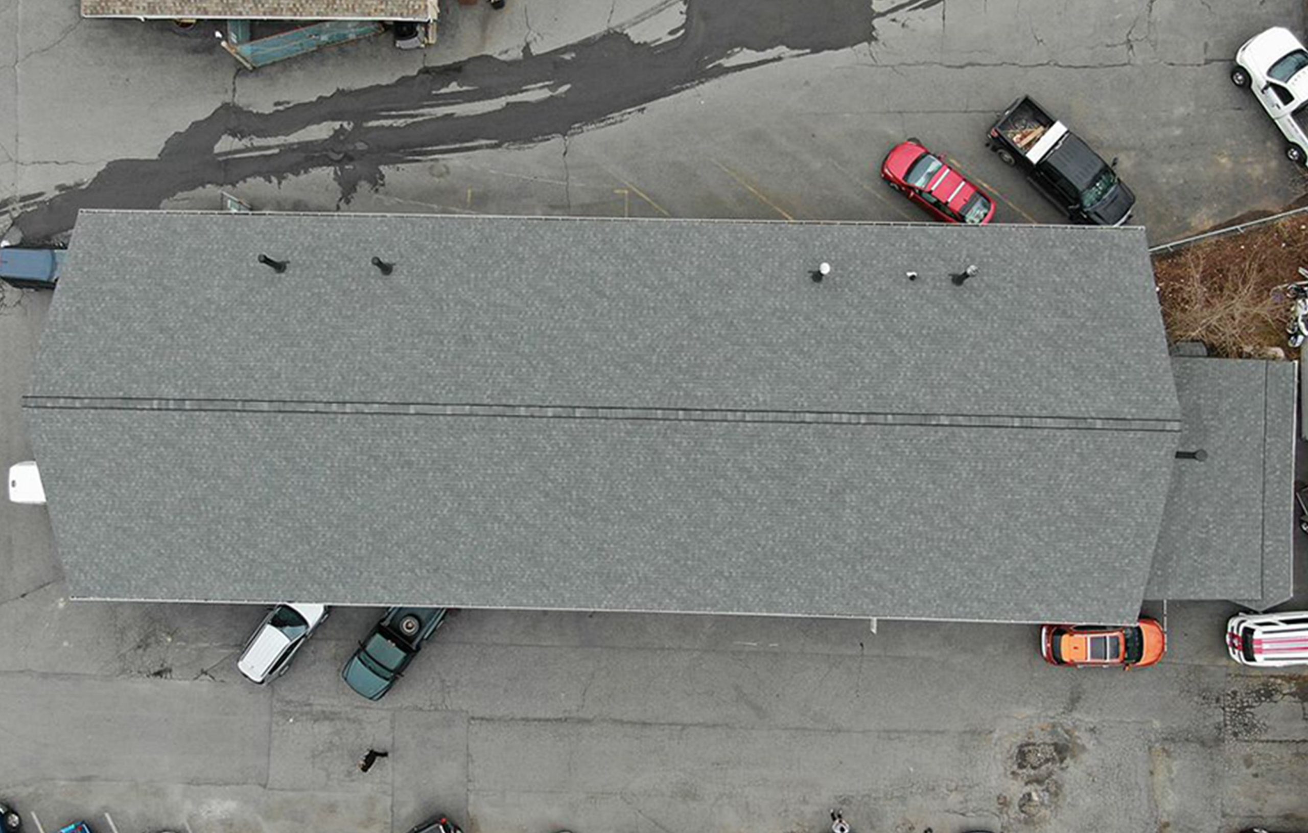 Overview of a black tile roof for a commercial building