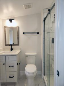 Recently remodeled bathroom post-fire; new fixtures including a vanity, toilet, and standing shower included.