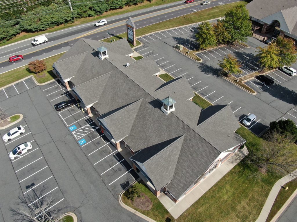 Aerial view of commercial building with a new roof.