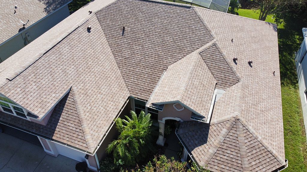 Overview of a brown tile roof replacement in Melbourne, FL